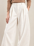 Colombe Trousers, detail of the pleats and relaxed cut
